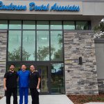 doctors standing in front of {PRACTICE_NAME} office building