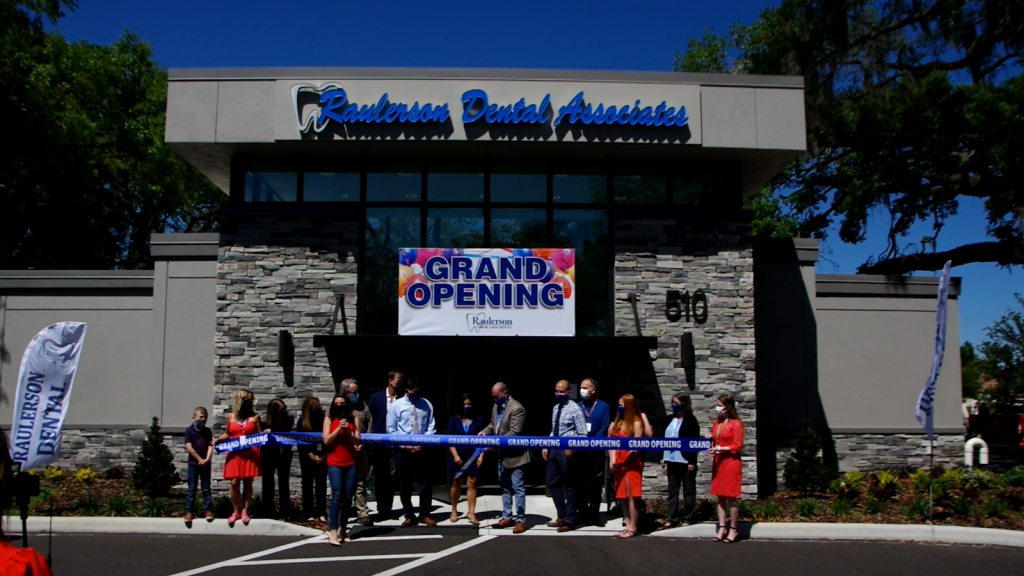 cutting the ribbon at the {PRACTICE_NAME} grand opening