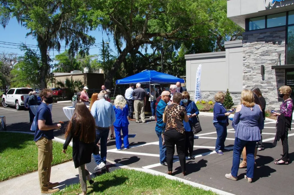 Crowd outside of {PRACTICE_NAME} at the grand opening