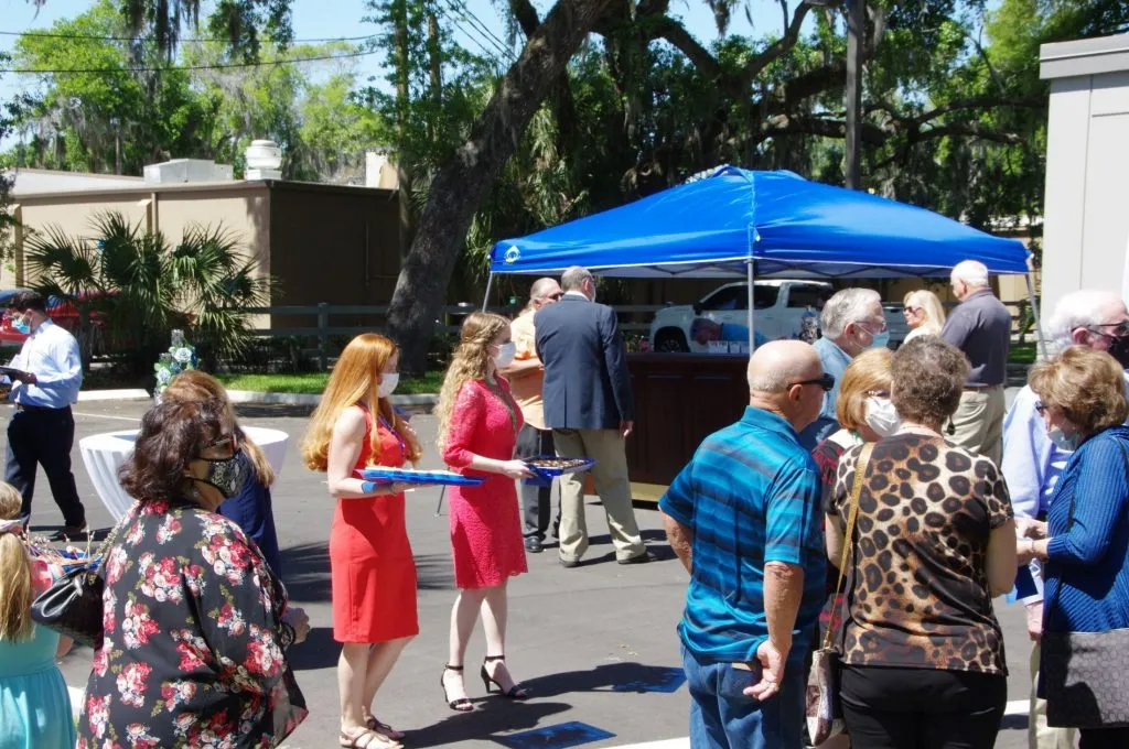 Crowd outside of {PRACTICE_NAME} at the grand opening