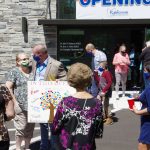Crowd outside of {PRACTICE_NAME} at the grand opening