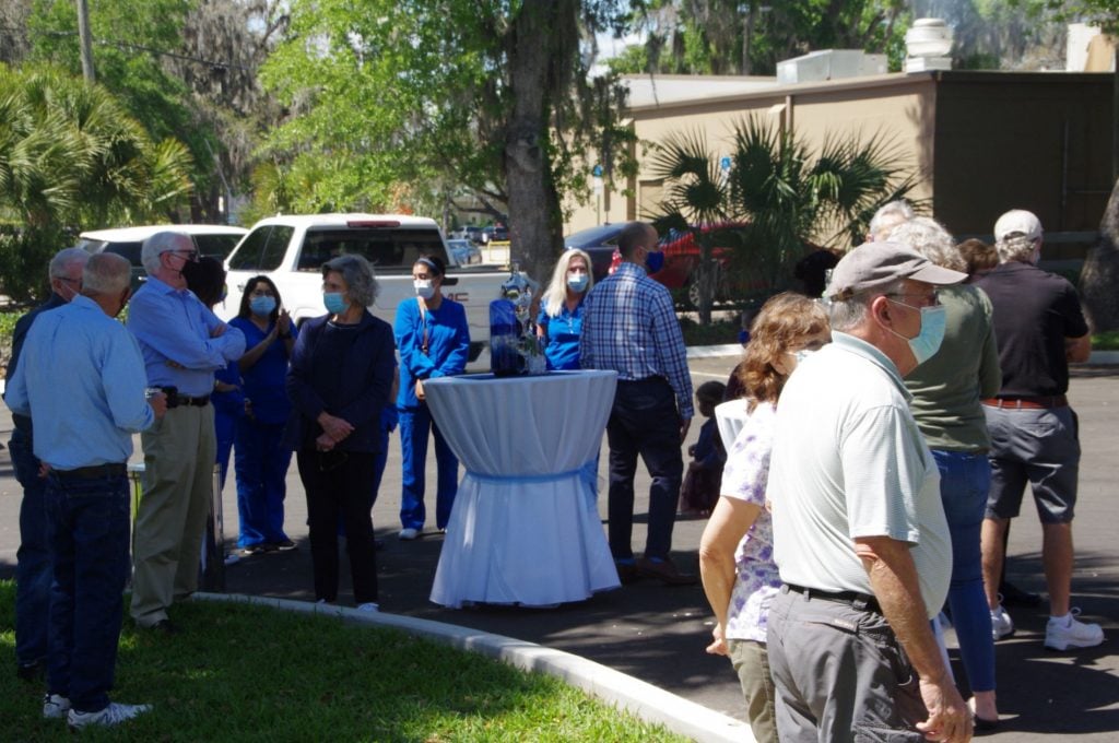 Crowd outside of {PRACTICE_NAME} at the grand opening