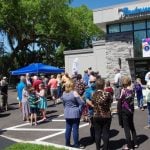 Crowd outside of {PRACTICE_NAME} at the grand opening