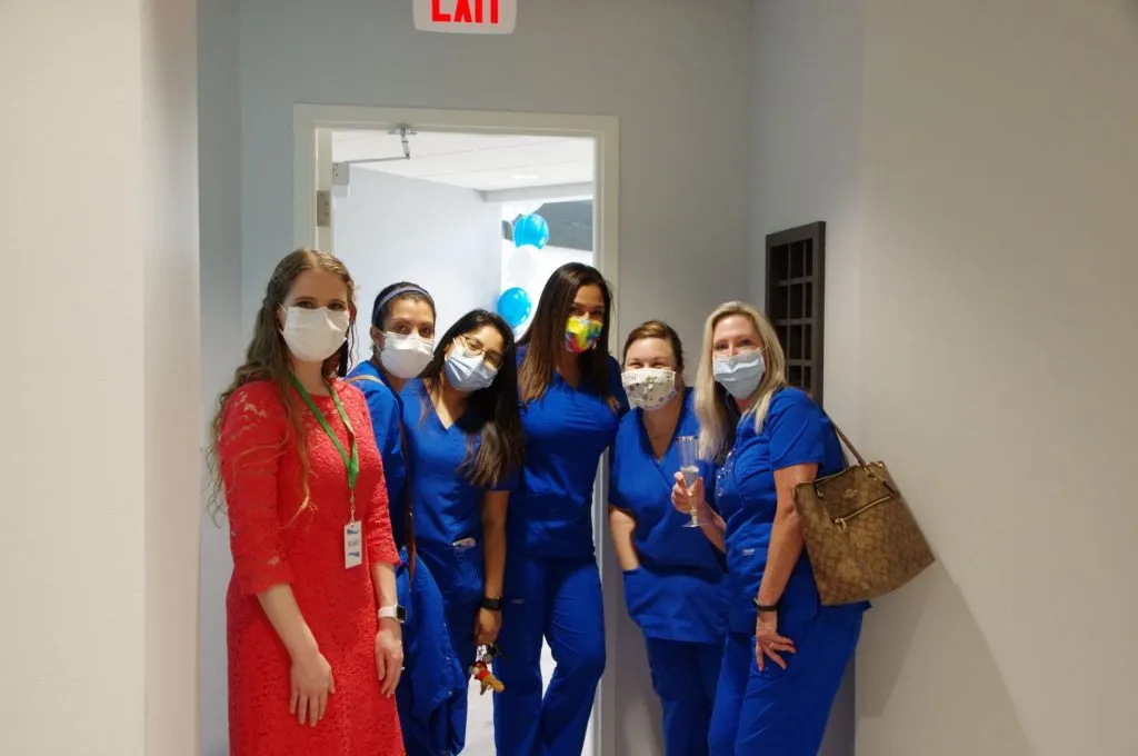 Staff at the grand opening of {PRACTICE_NAME}