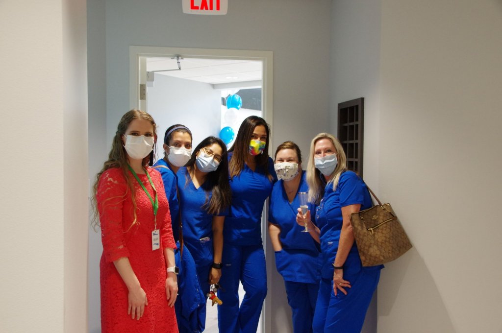 Staff at the grand opening of {PRACTICE_NAME}
